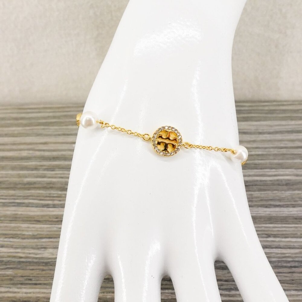 Tory Burch Crystal Logo & Imitation Pearl Station Bracelet Ivory/Tory Gold OS - Picture 11 of 16